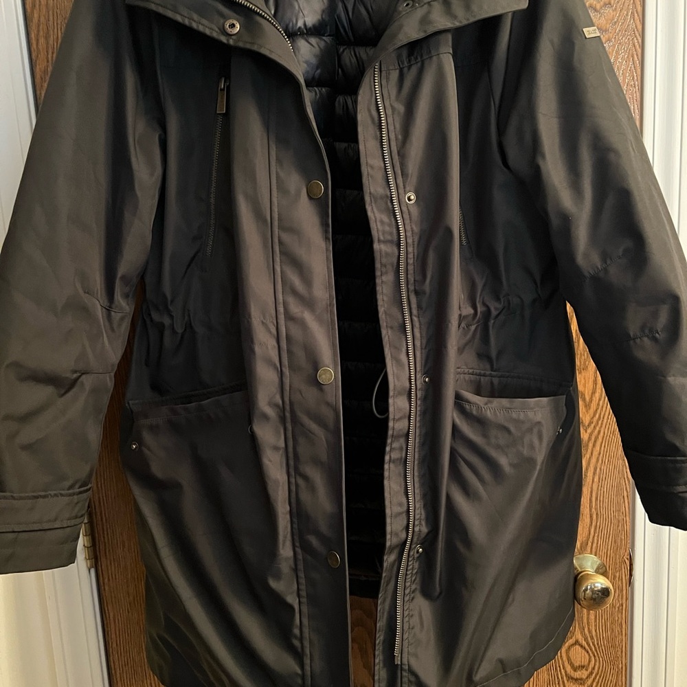 Woman’s dark green winter jacket